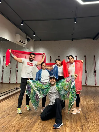 Posing with our props after a fun-filled Holi dance session.