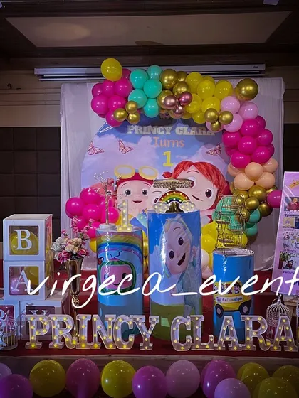 Another take on the popular Cocomelon theme, this time with a bright pink and yellow color scheme for Princy Clara's first birthday.