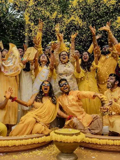 The grand entrance with colorful smoke bombs makes for an epic start to the Haldi festivities. We love capturing the energy and excitement of the wedding party.