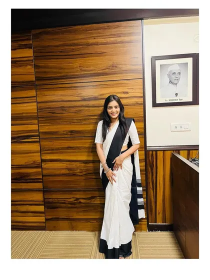 Standing in my office, a space I earned through dedication. This environment is where I strategize and work tirelessly on cases of online harassment and fraud.