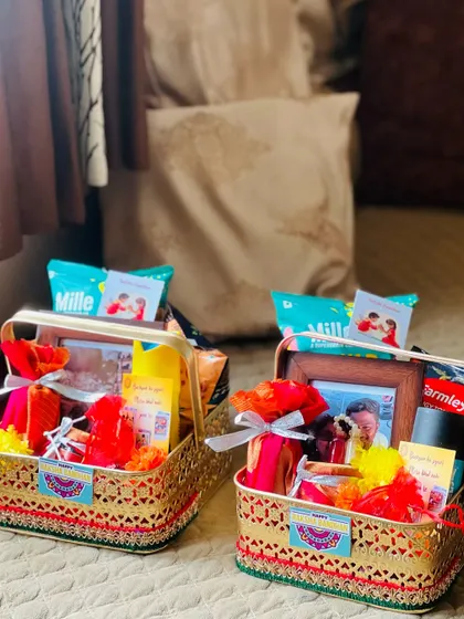 Two personalized Rakhi hampers, one with a photo frame, ready to be gifted to brothers.
