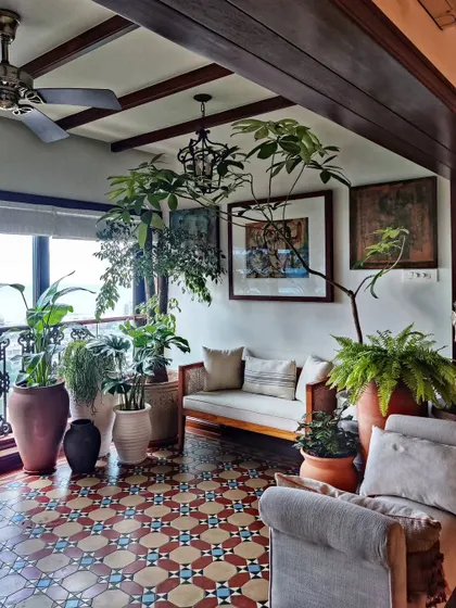 A snippet from one of the most charming homes we've worked on. The space was already stunning, and we added layers of green in terracotta pots to enhance its earthy, old-world magic.
