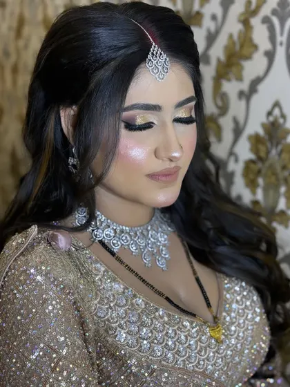 Eyes closed to show the beautiful blend of gold and bronze eyeshadows. This is a versatile glam eye look that suits many different outfits and occasions.