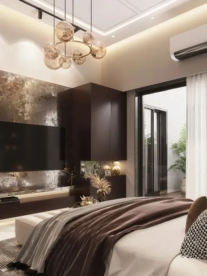 This view of the modern bedroom highlights the custom-designed TV unit with an abstract, textured back panel. The design uses a warm, earthy color palette and sculptural art to create a space that feels both contemporary and comfortable.