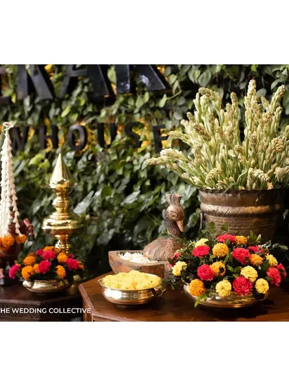We use antique brassware, like these traditional lamps and bowls, to add a touch of elegance and authenticity. Filled with fresh flowers and water, they beautifully complement the vibrant colour palette of a Haldi ceremony.