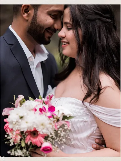 A close-up portrait focusing on the intimacy and connection between the couple, with a beautiful floral bouquet.