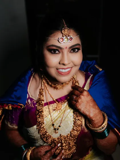 A close-up portrait of the bride, her happy smile and confident gaze showing she's ready for her big day.
