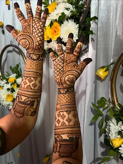 A classic bridal design with circular motifs and check patterns, set against a festive floral arrangement.