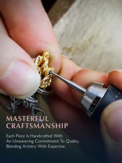 Masterful craftsmanship. Each piece is handcrafted with an unwavering commitment to quality, blending artistry with expertise. Here, an artisan is carefully refining the details of a gold piece.