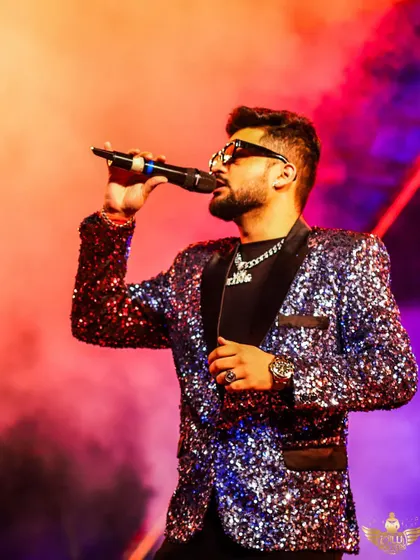 A close-up of our vocalist, deep in the zone. The connection with the music and the audience is what makes our performances so special.