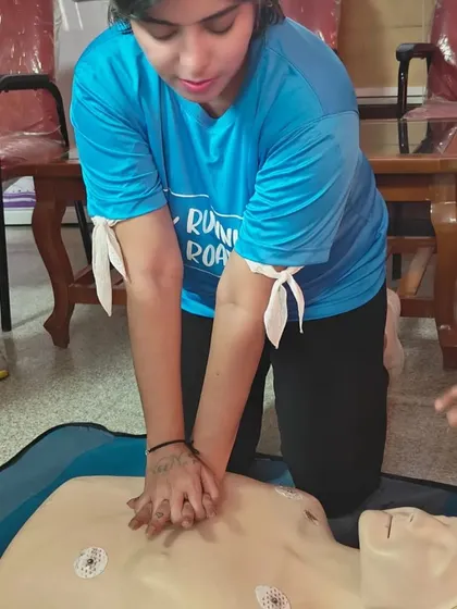 One of our members practicing chest compressions during a CPR and Basic Life Support training session. Safety is paramount, and we ensure our volunteers are equipped with life-saving skills.