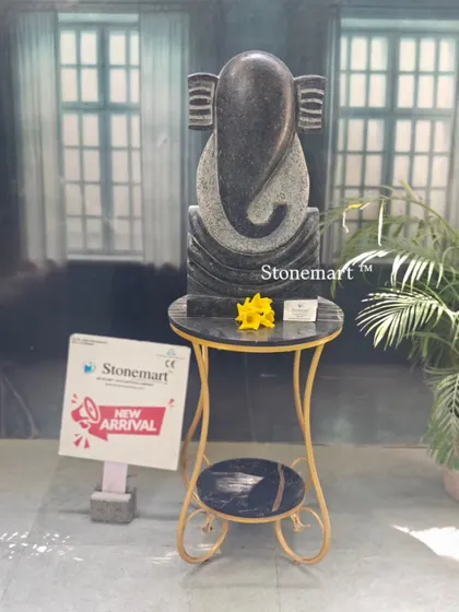 The black granite abstract Ganesha statue, standing 21 inches tall. Its minimalist form is perfect for architects and designers looking for a modern spiritual piece for hotels and resorts.