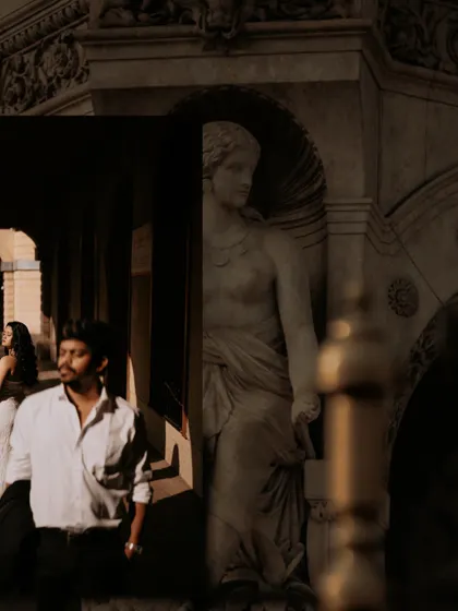 A creative composition layering different elements of the architectural location with a candid shot of the couple.
