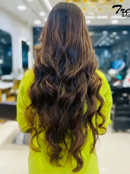 Long, luscious waves with subtle highlights. This look is all about creating healthy, shiny hair that looks effortlessly beautiful.