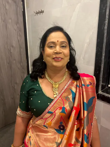 The beautiful mother of the bride. I gave her a classic look with a soft hairstyle that suited her elegant saree.