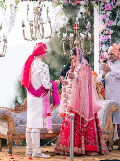 The couple at the mandap during the wedding ceremony. This shot captures a quiet, intimate moment between them amidst the rituals.