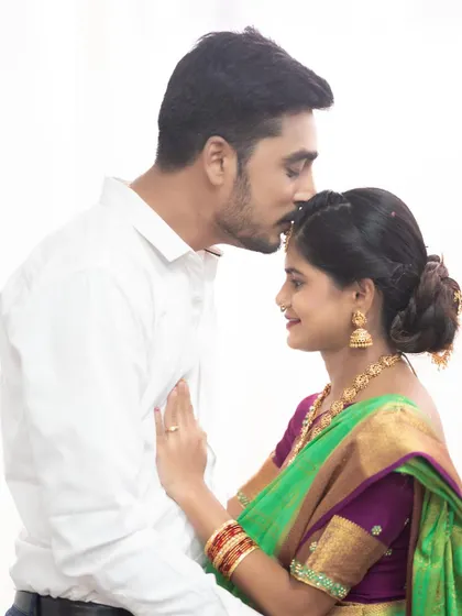 A traditional maternity shoot featuring a couple in coordinated ethnic wear. We have a wide range of sarees and kurtas for rent.