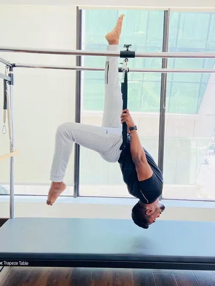 Slow progress is still progress. This hanging inversion on the Cadillac is a fantastic exercise for building functional strength and improving flexibility. Every session brings you one step closer to your goals.