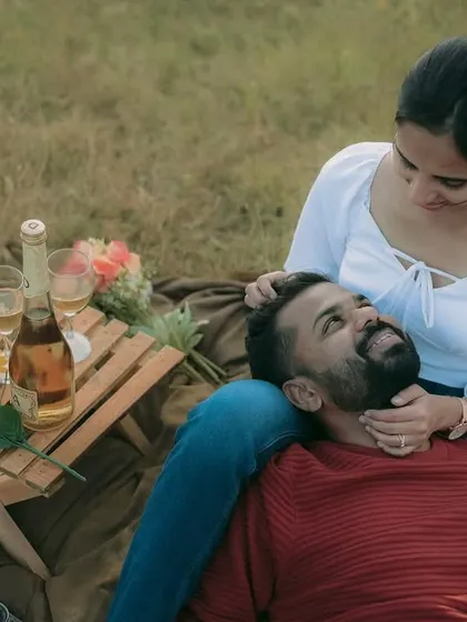 A relaxed and affectionate moment from a picnic pre-wedding session. These casual shots feel personal and real.