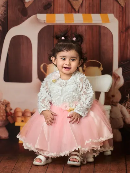 A full-length view of this adorable outfit and setup. The indoor studio allows us to create detailed and imaginative scenes, like this one with a miniature food cart and stuffed bunnies.