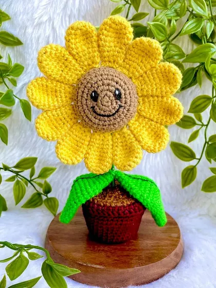 Meet my little smiling sunflower pot. This cheerful fellow is perfect for a desk or a shelf, bringing a bit of sunshine indoors. It’s one of my most popular desk decor items, and I just love the happy face on it.