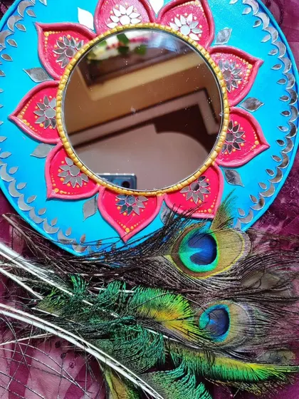 Another view of the lotus Lippan art mirror, showing the intricate details of the mirror placement.