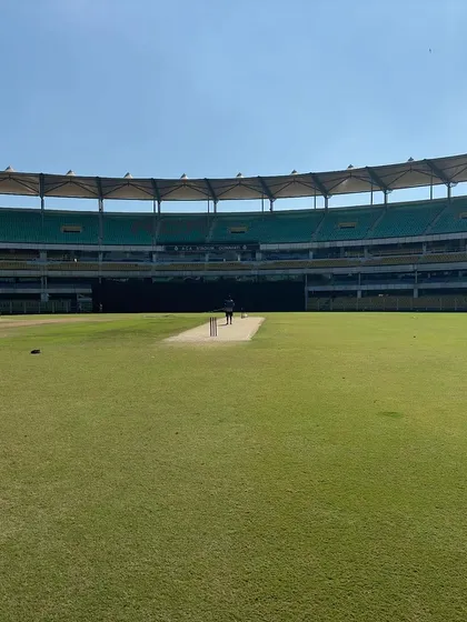 A wide shot of the stadium during a practice session. The calm before the storm.