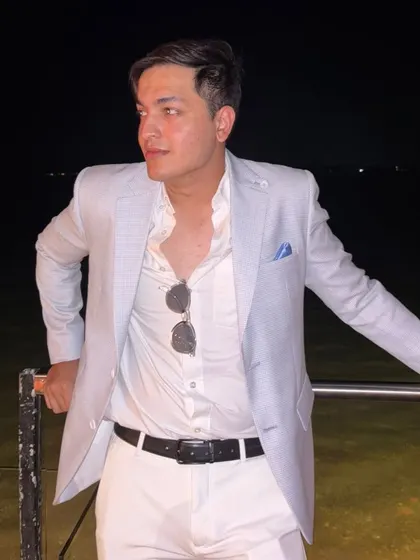 This Arctic Blue linen jacket is a client favorite for destination weddings and day events. It's seen here styled for an evening by the water, proving its versatility from day to night.
