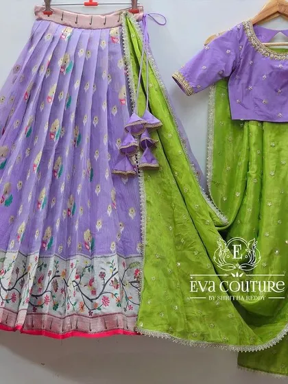 A beautiful lavender floral lehenga with a contrasting lime green dupatta. The simple blouse and printed skirt create a fresh and elegant look.