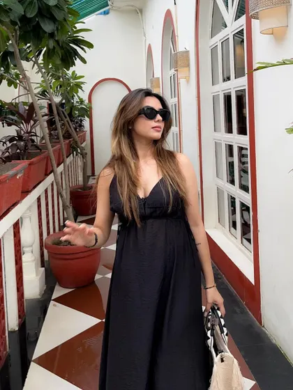 Another pose in the versatile and chic black summer dress.