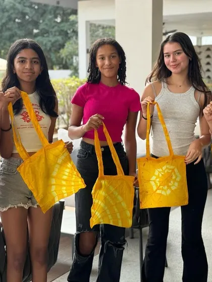 A birthday party filled with creativity and sunshine. These girls celebrated by learning the art of tie-dye, using a natural dye bath made from marigold petals. Each one left with a bright, beautiful tote bag they designed themselves.