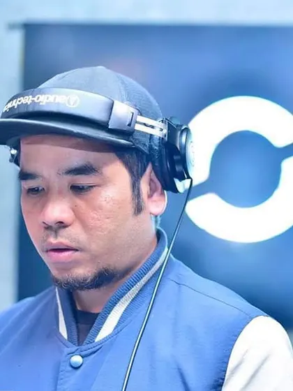 In the zone, in my elements. A close-up shot of me with my headphones on, completely focused on the music.