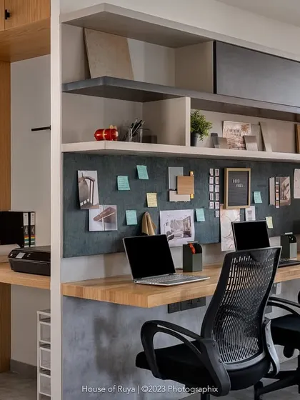 Our main workstation area plays with a mix of warm and cool tones. We combined rubber wood and oak finishes with a concrete-finish base and flooring to create a balanced and productive environment for the design team.