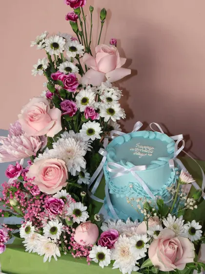 Another view of our Women's Day cake and flower hamper. The soft colors of the cake and flowers complement each other perfectly.