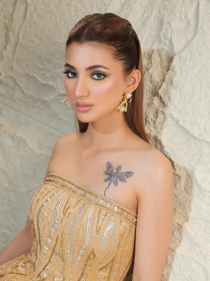 Another angle of this chic look. The tattoo adds to the edgy, modern feel.