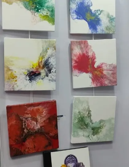 A collection of small abstract canvas paintings, demonstrating various fluid art techniques to our students.