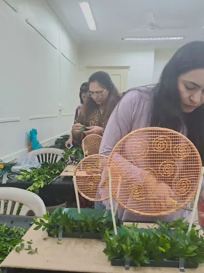 Students getting creative during our Diwali Fresh Flower Decoration Workshop. This session focused on crafting unique festive decor, with participants learning to work with decorative frames and fresh foliage to build their designs.