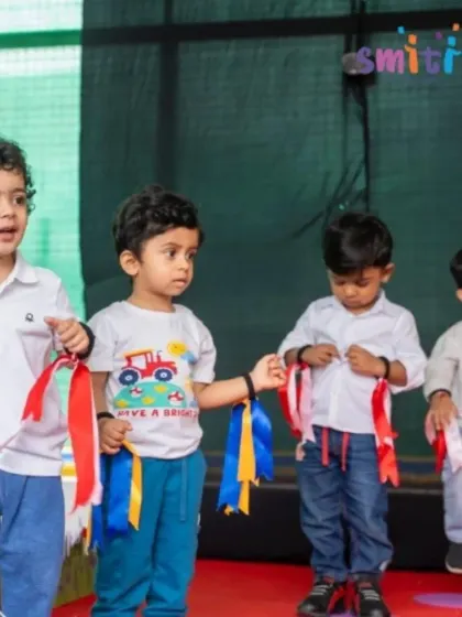 A group of boys performs with colorful ribbons, adding a visual flourish to their dance. We use simple props to make performances more dynamic and fun.