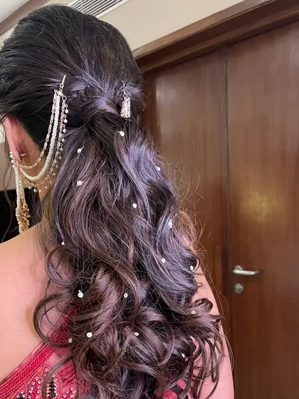 A side view of the romantic ponytail, perfect for a sangeet or engagement.