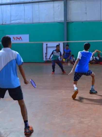 A doubles match in progress at Manik Sports Academy, showing the teamwork and coordination developed in our programs.