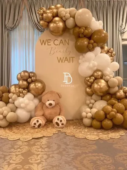 This is an example of my popular "We Can Bearly Wait" teddy bear theme, designed with a chic and modern neutral color palette. The combination of white, beige, and chrome gold balloons creates a sophisticated and warm look for any baby shower.