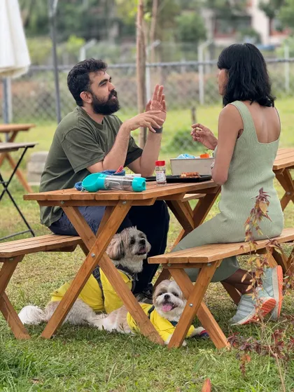 Deep in conversation while the dogs relax at their feet. Our camp is designed for these moments of connection.