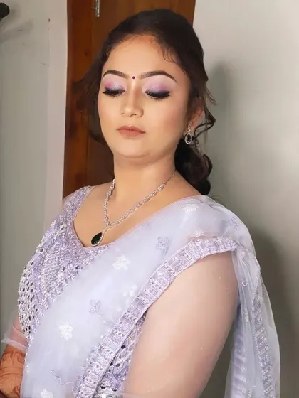 A close-up of the sangeet makeup, featuring shimmery lilac eyeshadow and a flawless base.