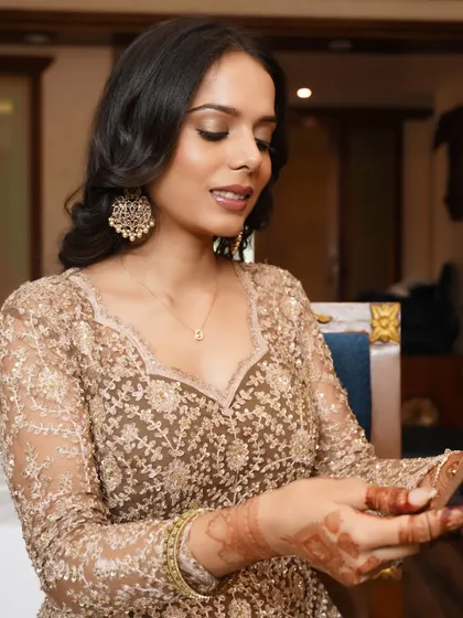 Makeup that defines sophistication. This look features a matte base, bronze shimmer on the eyes, and an effortless glow for a touch of nude glam.