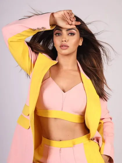 A powerful pose that adds a high-fashion feel to a standard studio photoshoot.
