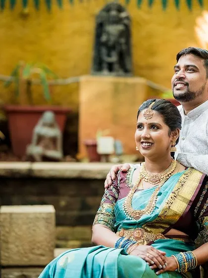 The couple sharing a happy, relaxed moment in a beautiful courtyard. Our goal is to capture you looking comfortable and genuinely happy together.