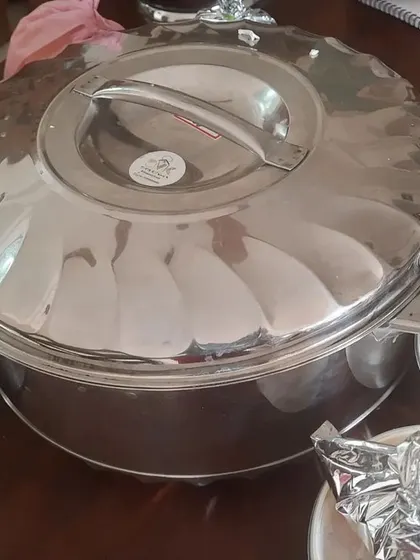 A large insulated casserole used for bulk delivery. We ensure your food stays hot and fresh until it reaches you, whether it's for a small get-together or a large party.