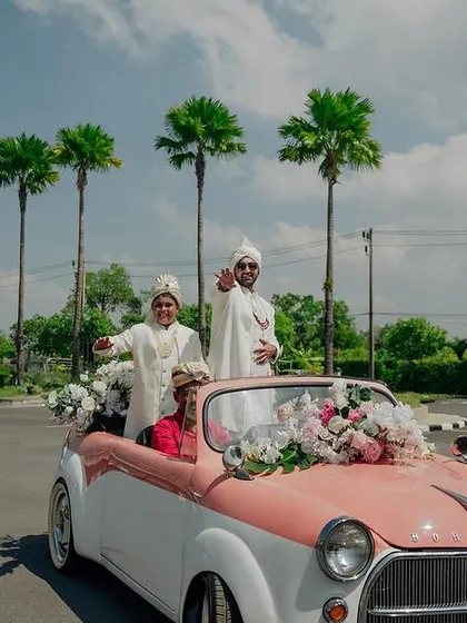 The groom makes a stylish entrance in a vintage convertible for his Baraat in Thailand.