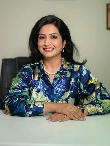 A close-up headshot with a warm, engaging smile. This type of shot is perfect for a client-facing professional like a coach, as it builds an instant rapport.