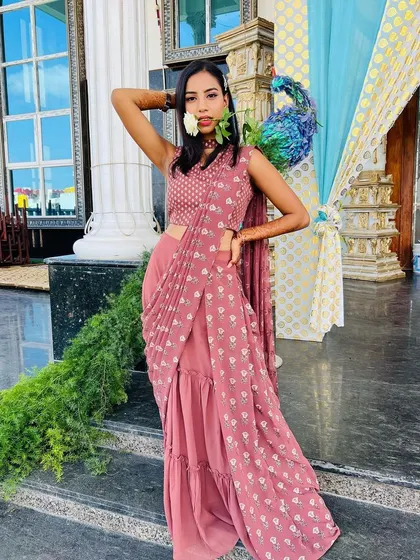 The entire look is a perfect inspiration for a modern wedding guest or bridesmaid attending an engagement party.